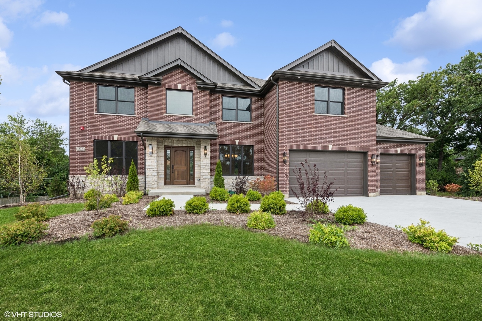 front view of a house with a yard