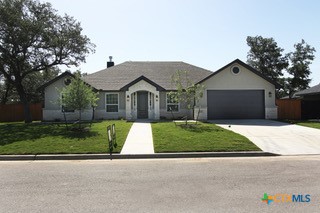 front view of a house and a garden