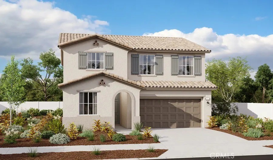 a front view of a house with a garden and garage