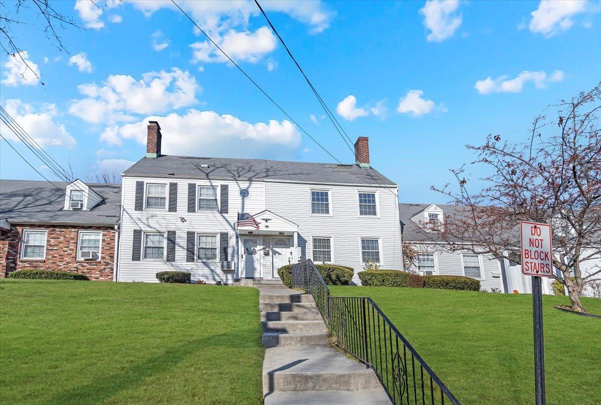 Colonial house with a front lawn