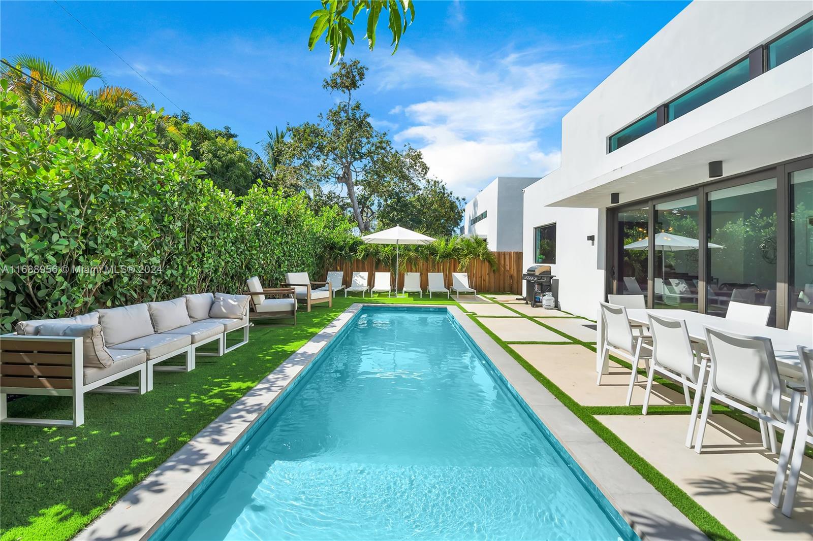 a view of a swimming pool with a patio