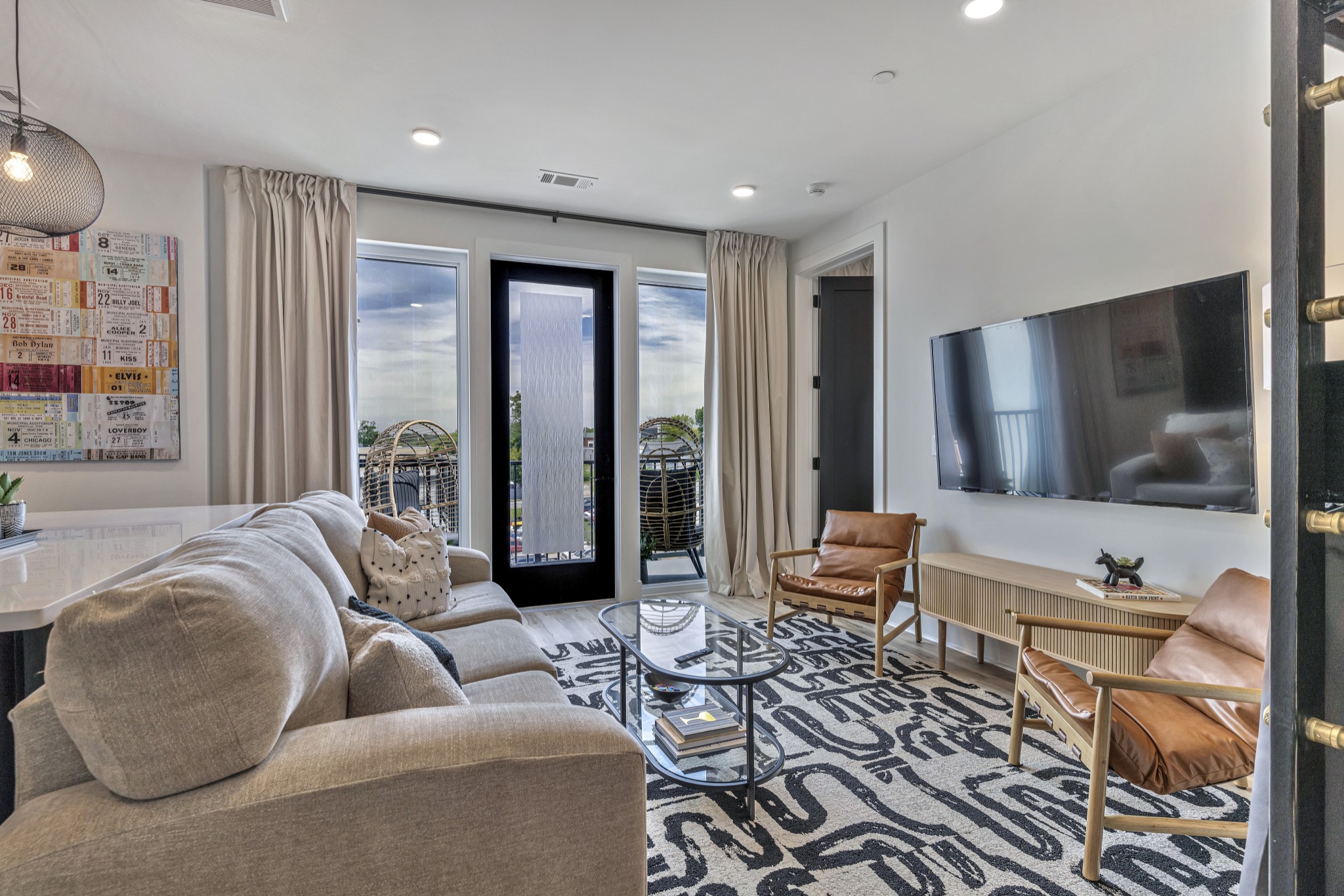 a living room with furniture and a flat screen tv