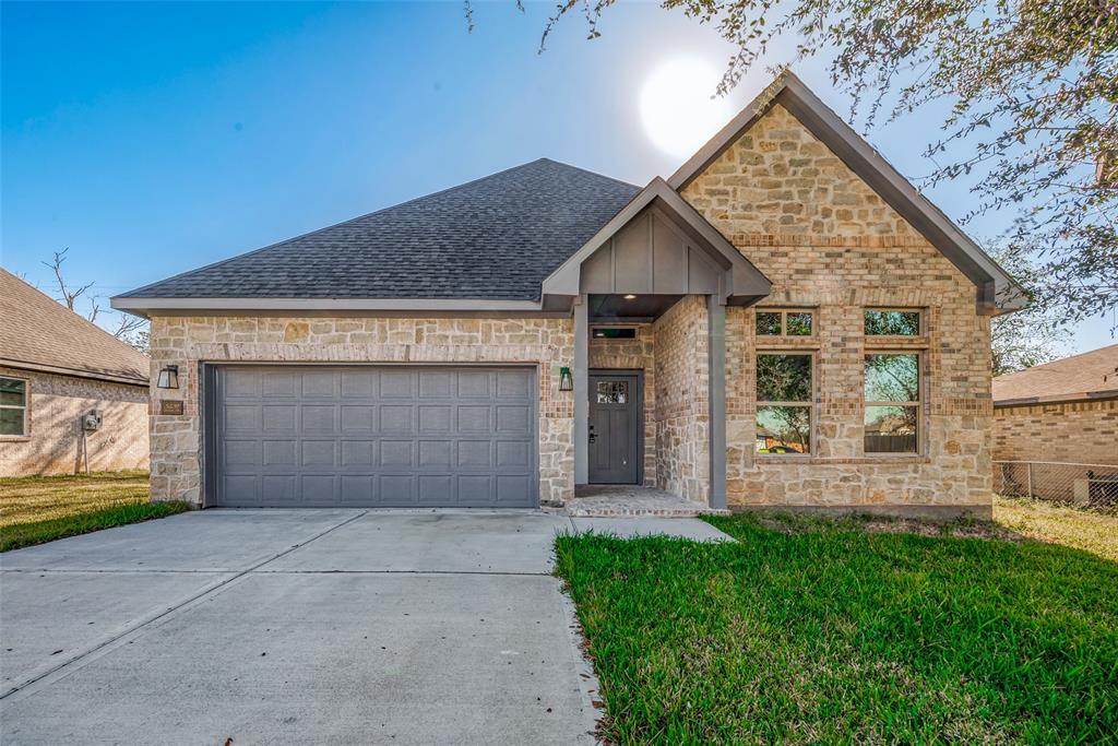 a view of front of house with garage