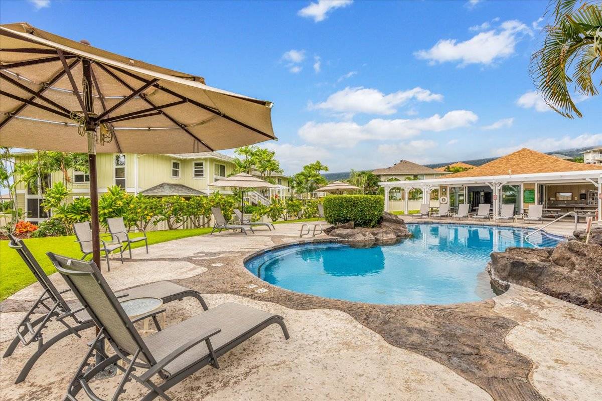 a view of a swimming pool with a patio