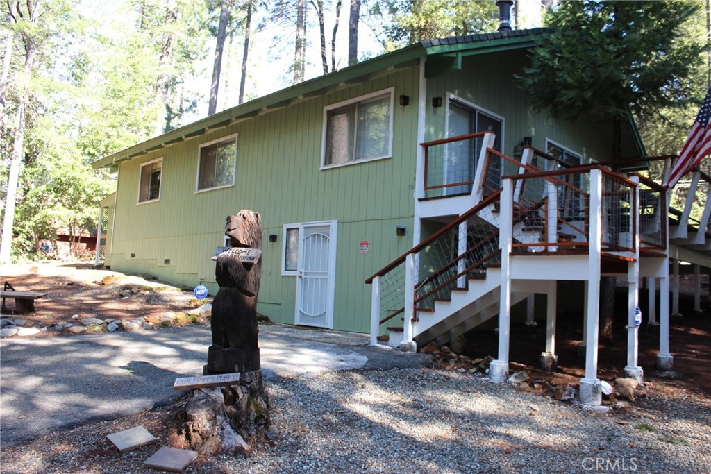 a front view of a house with parking area