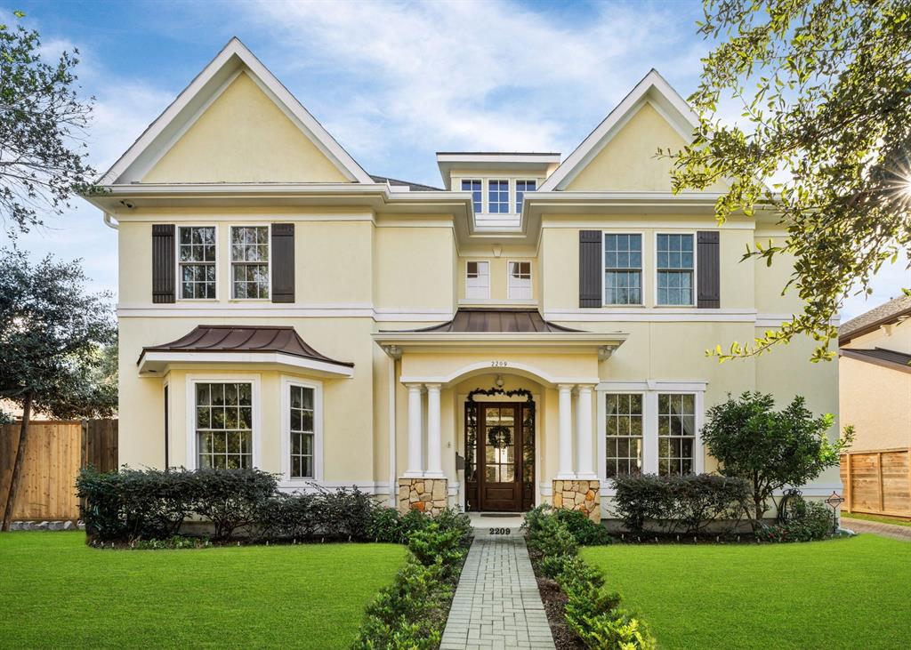 This stunning, yet strategically designed home is a must see!  The freshly sodded Zoysia Variety Grass showcases an enchanting view!