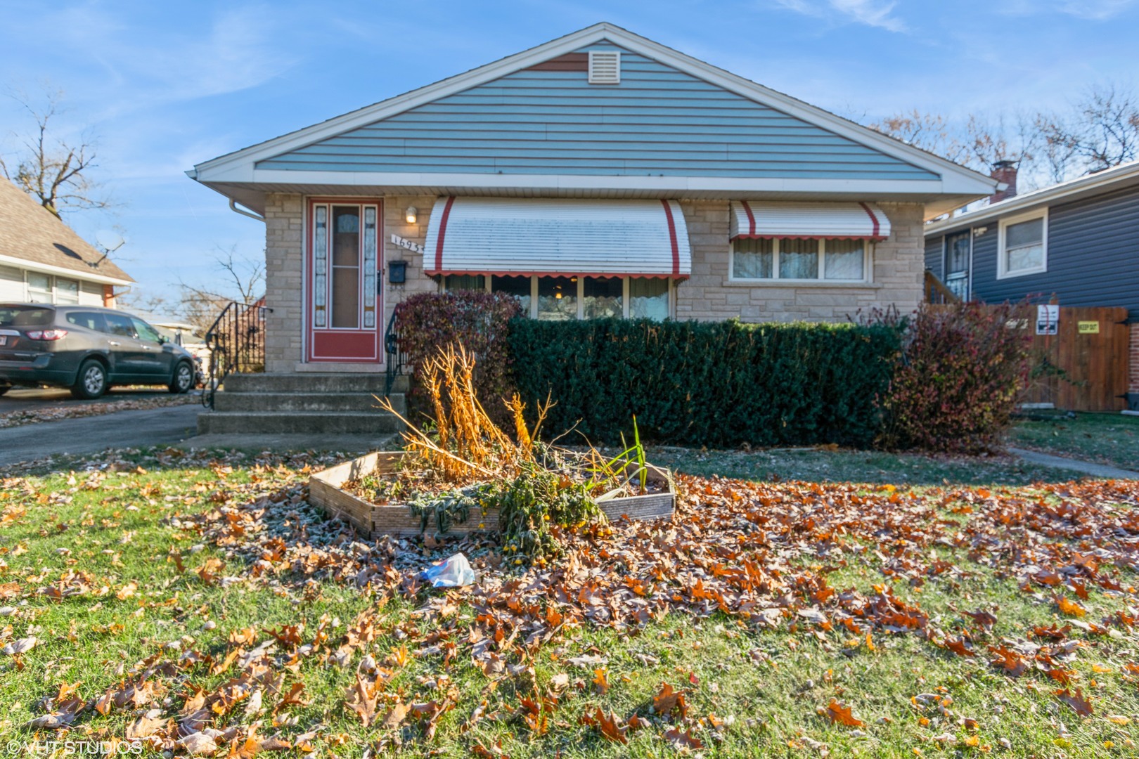 a front view of a house with garden