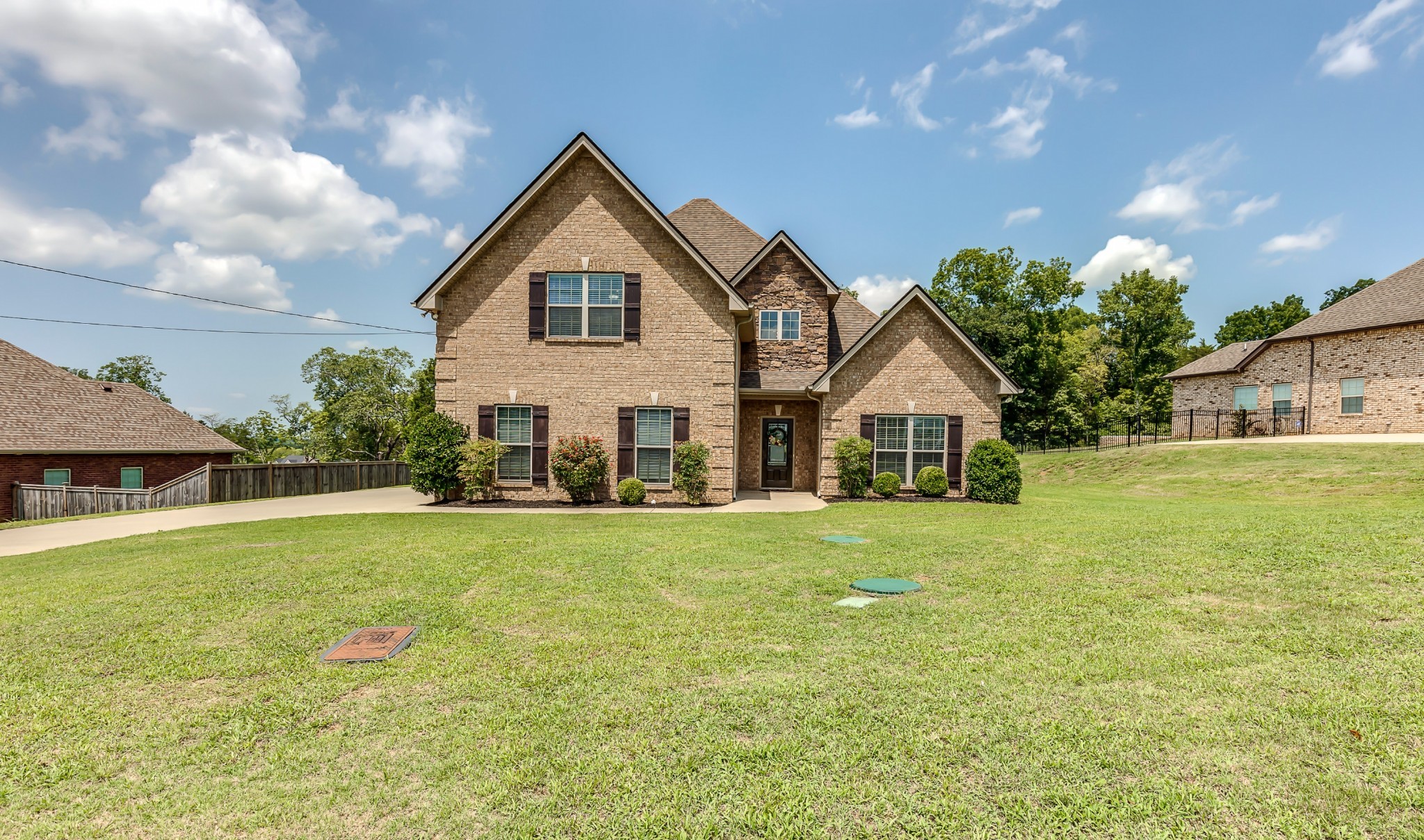 a view of a house with a yard and garage