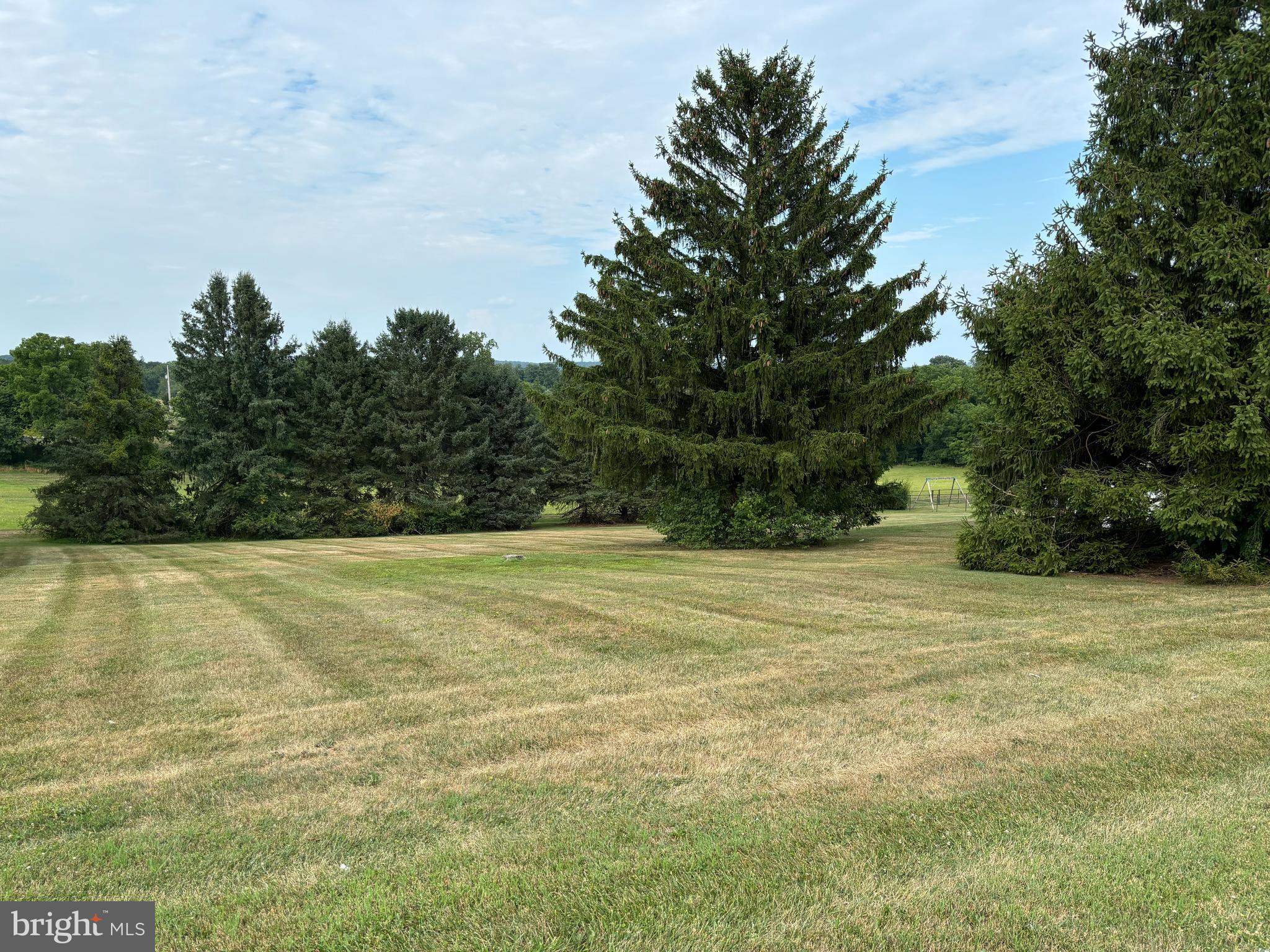 a view of a yard with an outdoor space