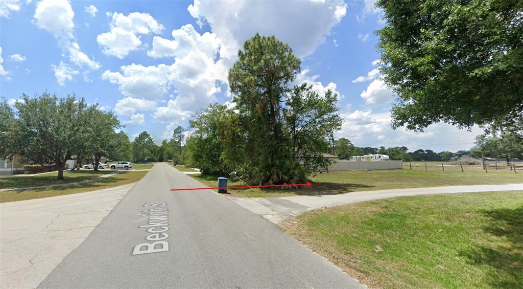 a view of a lake with a big yard