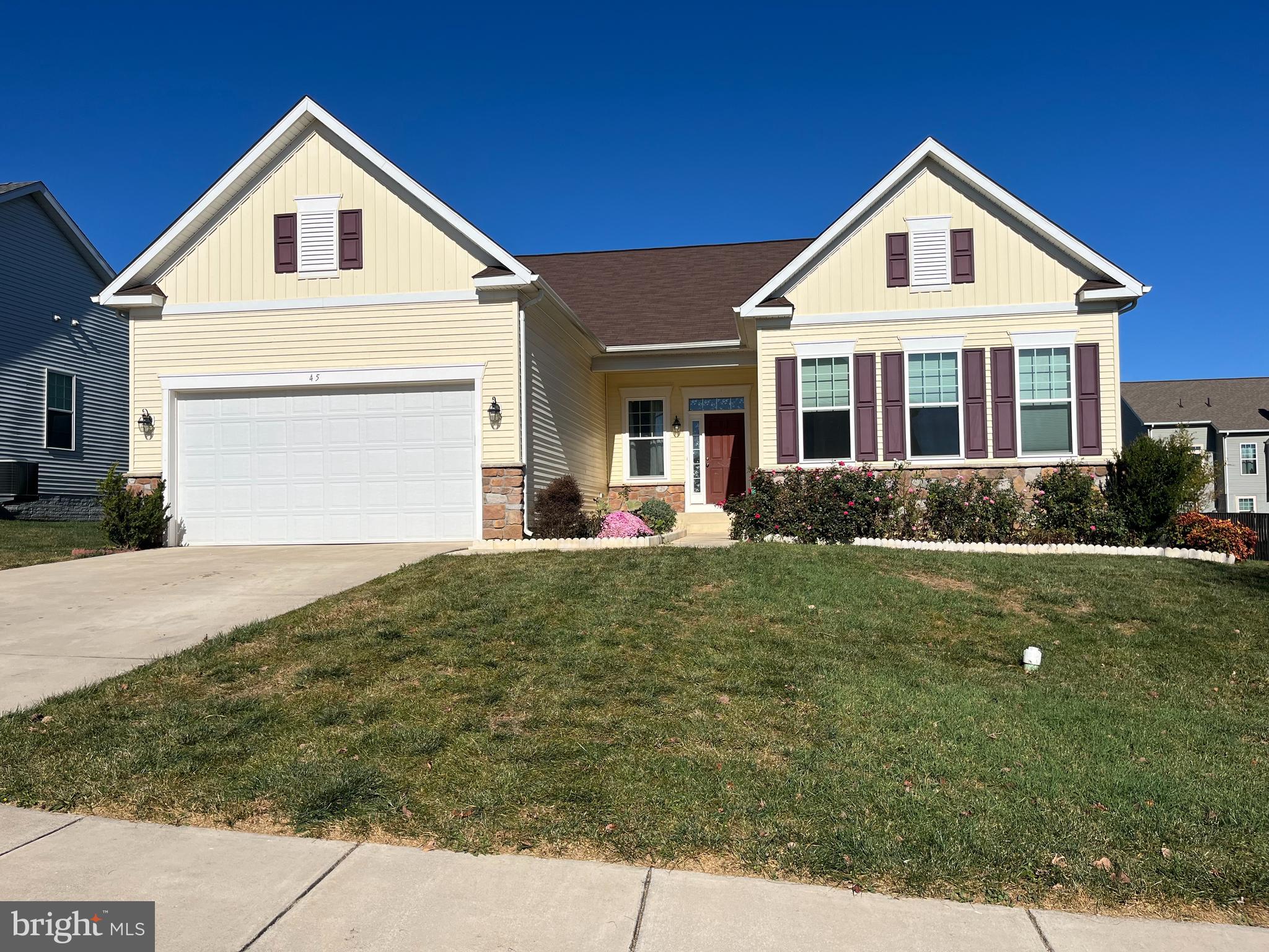 a front view of a house with garden