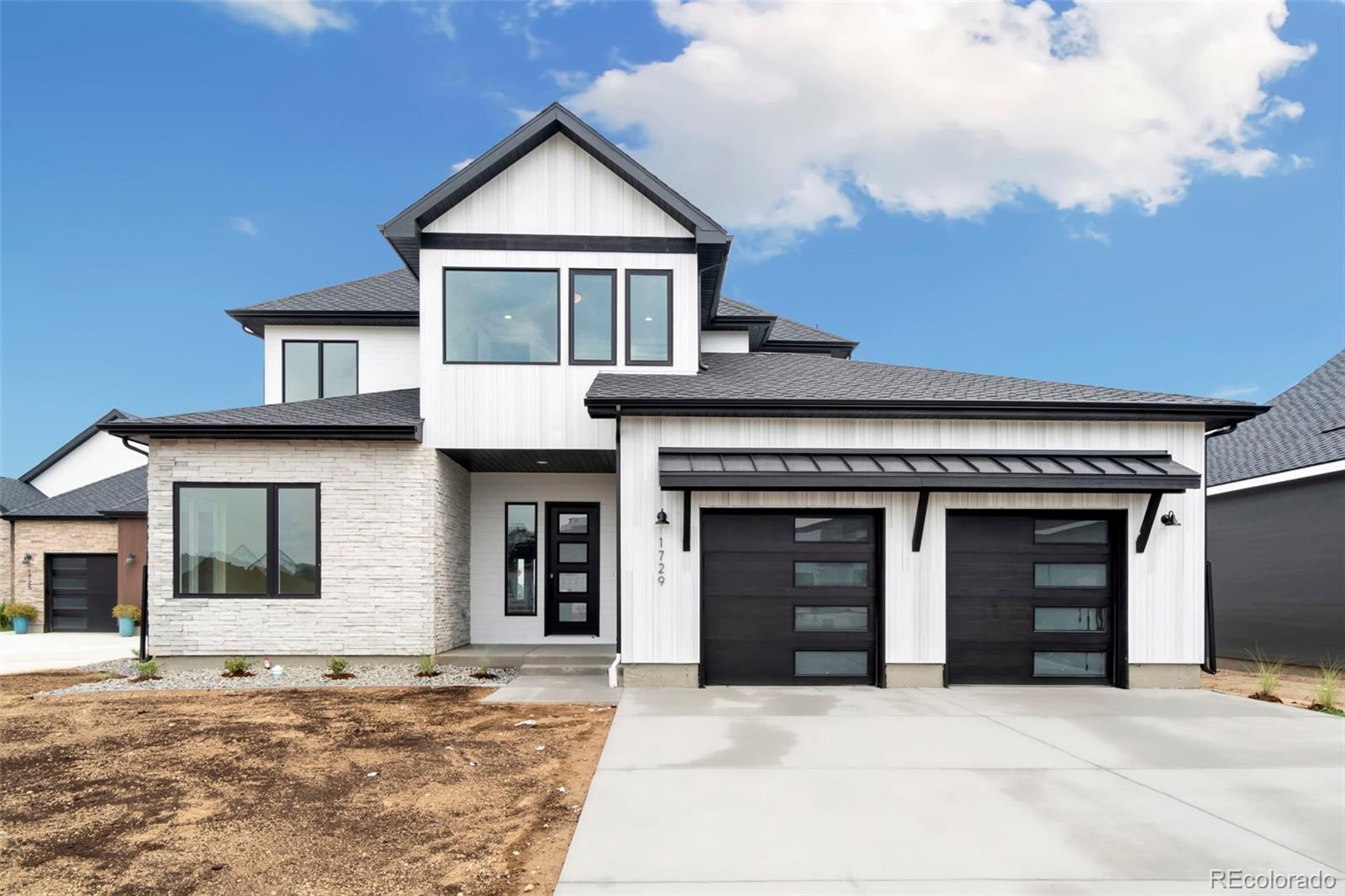 a front view of a house with a garage