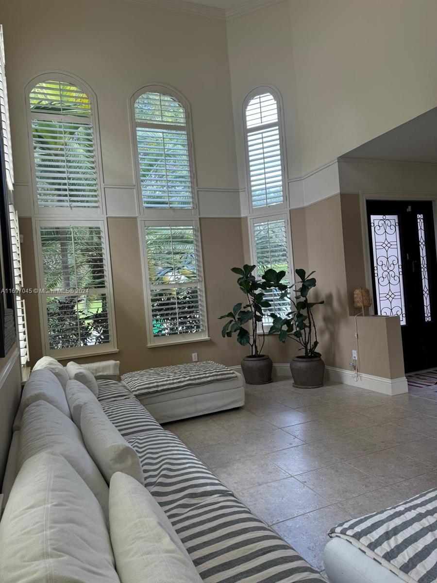 a living room with furniture and windows