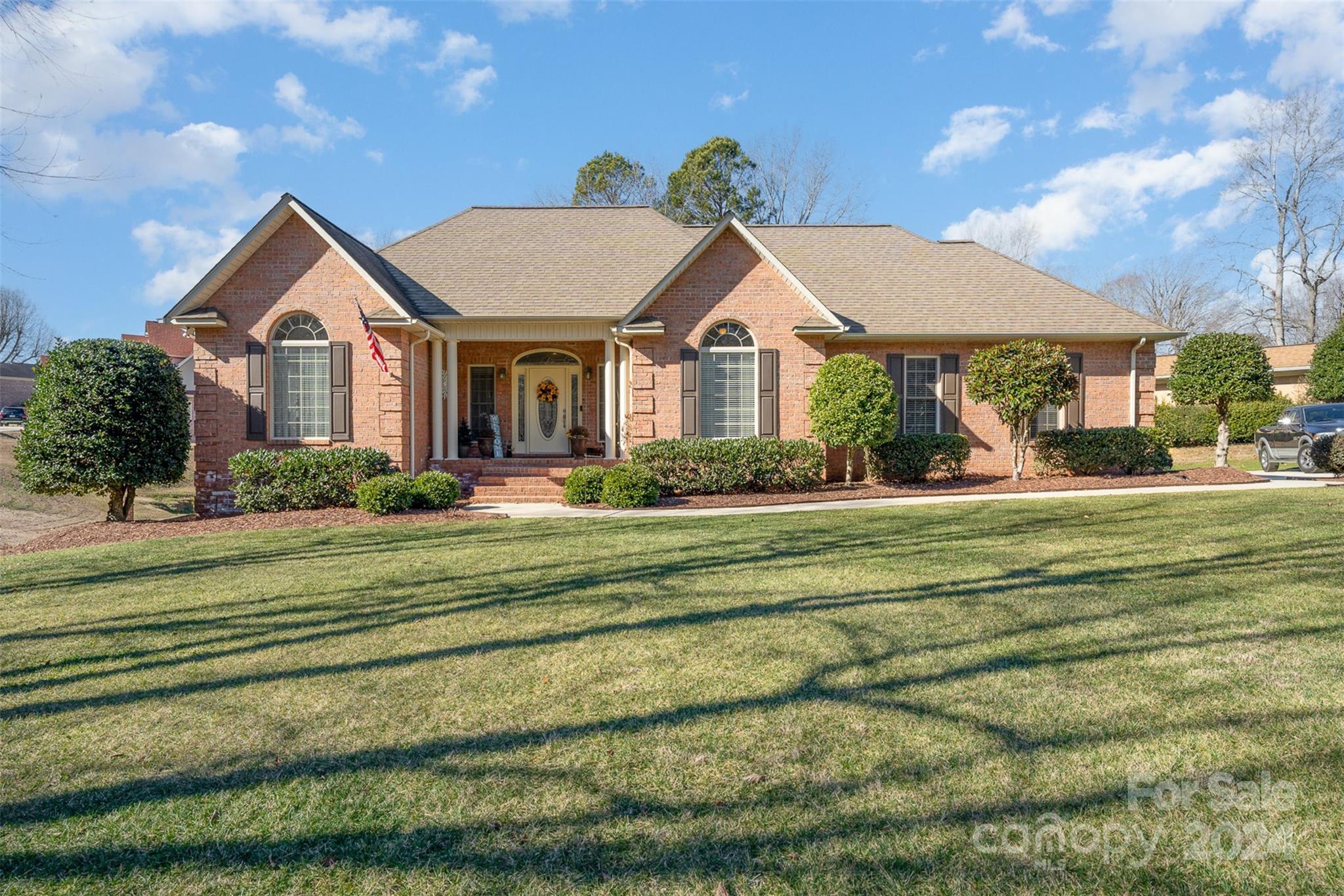 a front view of a house with a yard