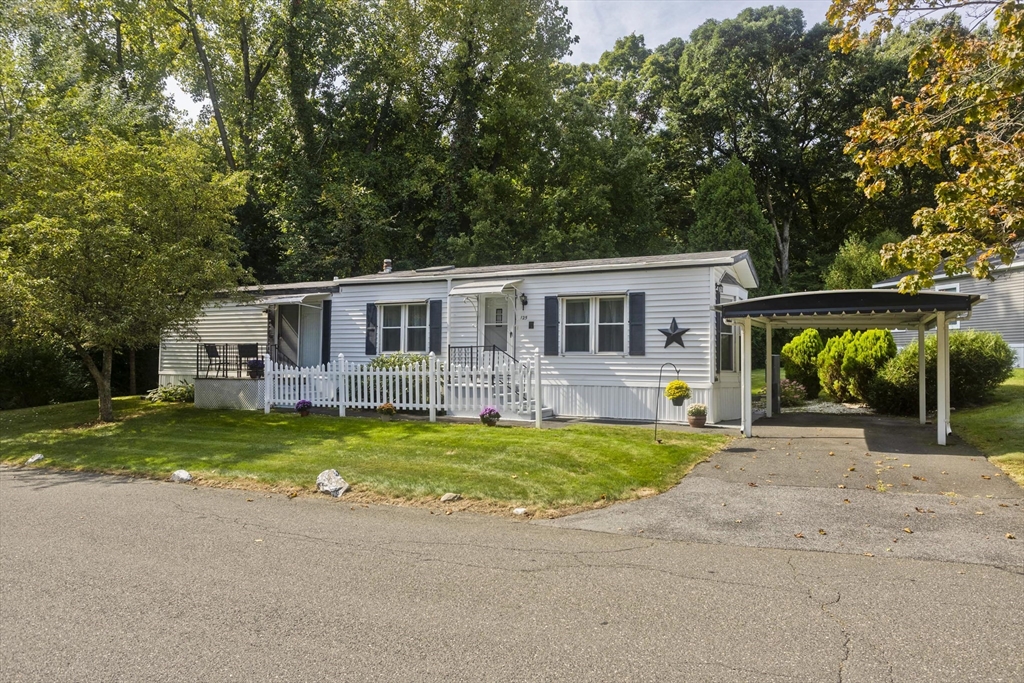 front view of a house with a yard