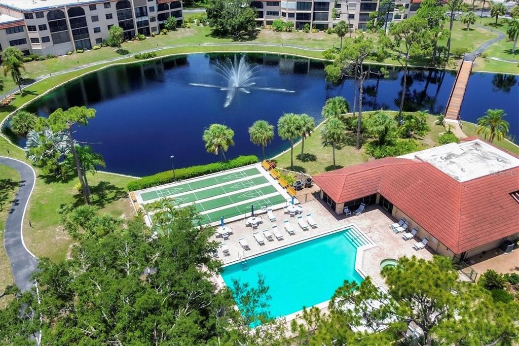 an aerial view of a house with a lake view