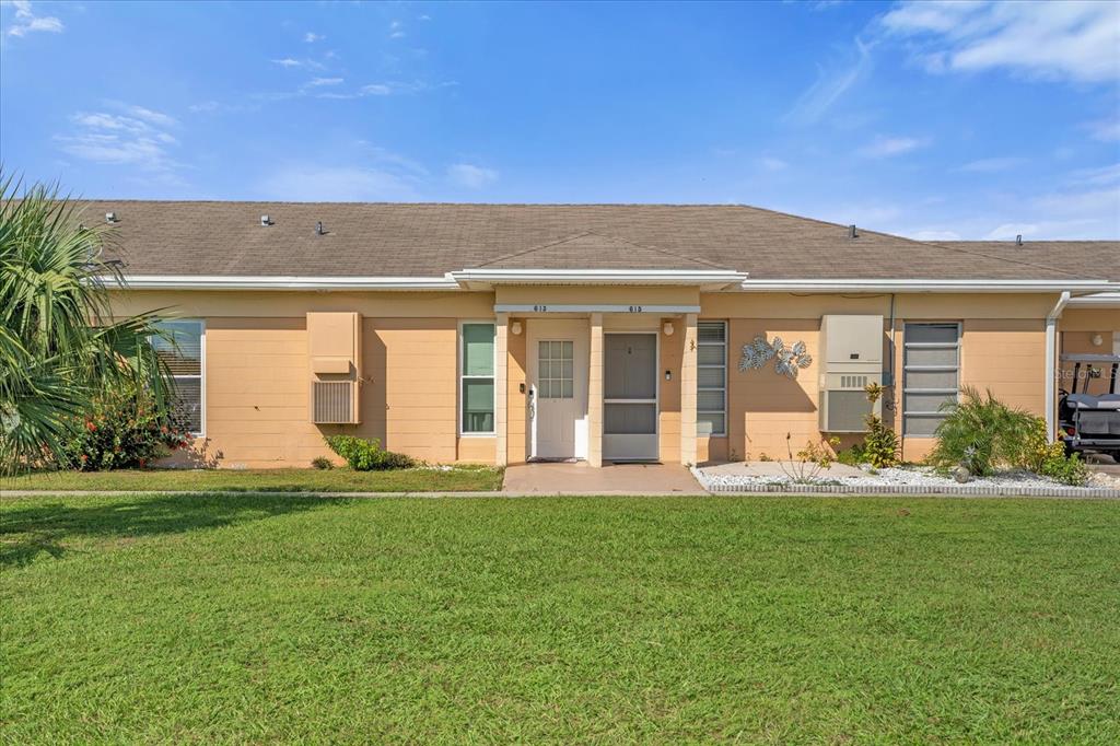 front view of a house with a yard