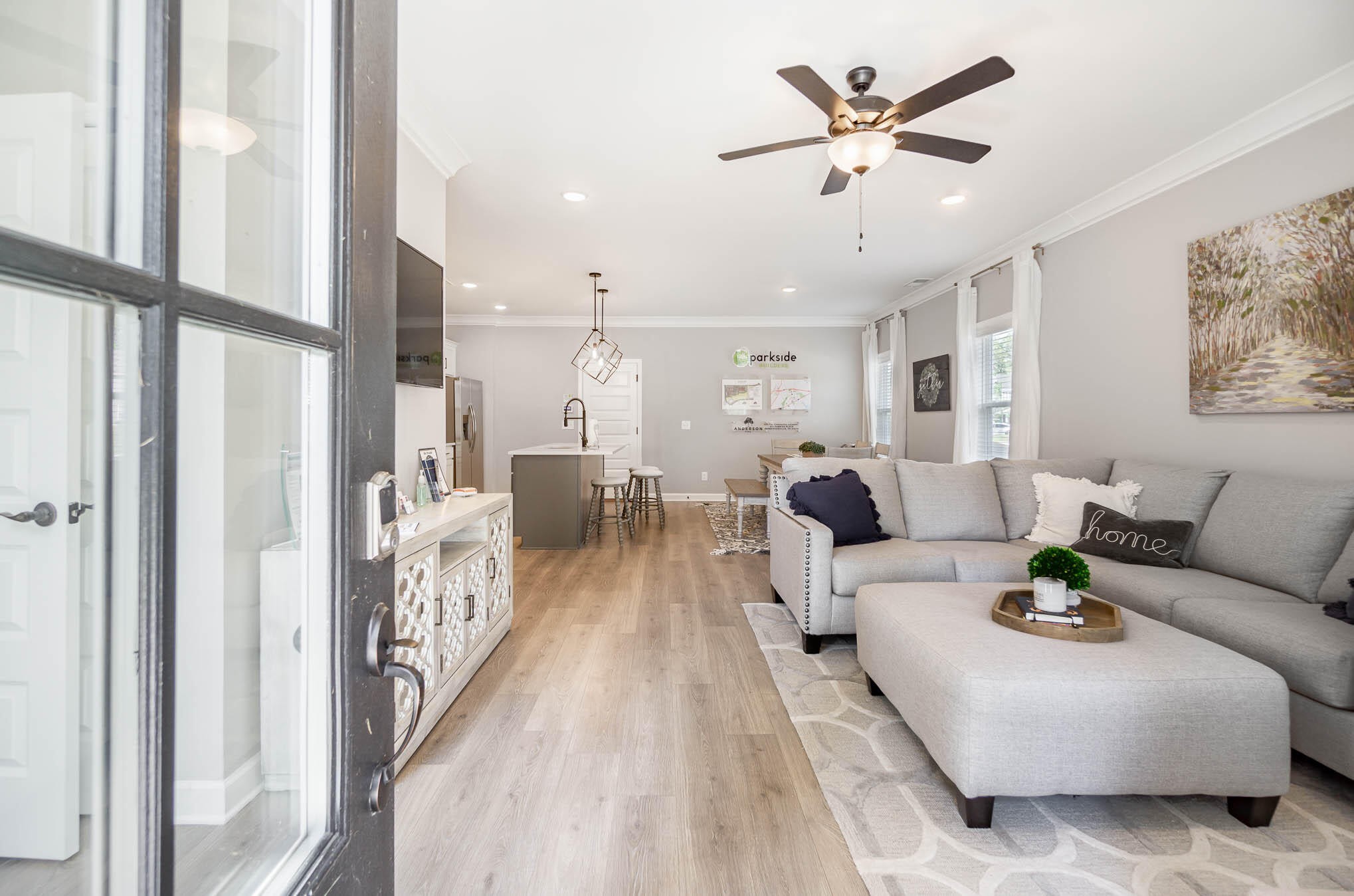 a living room with furniture and a chandelier