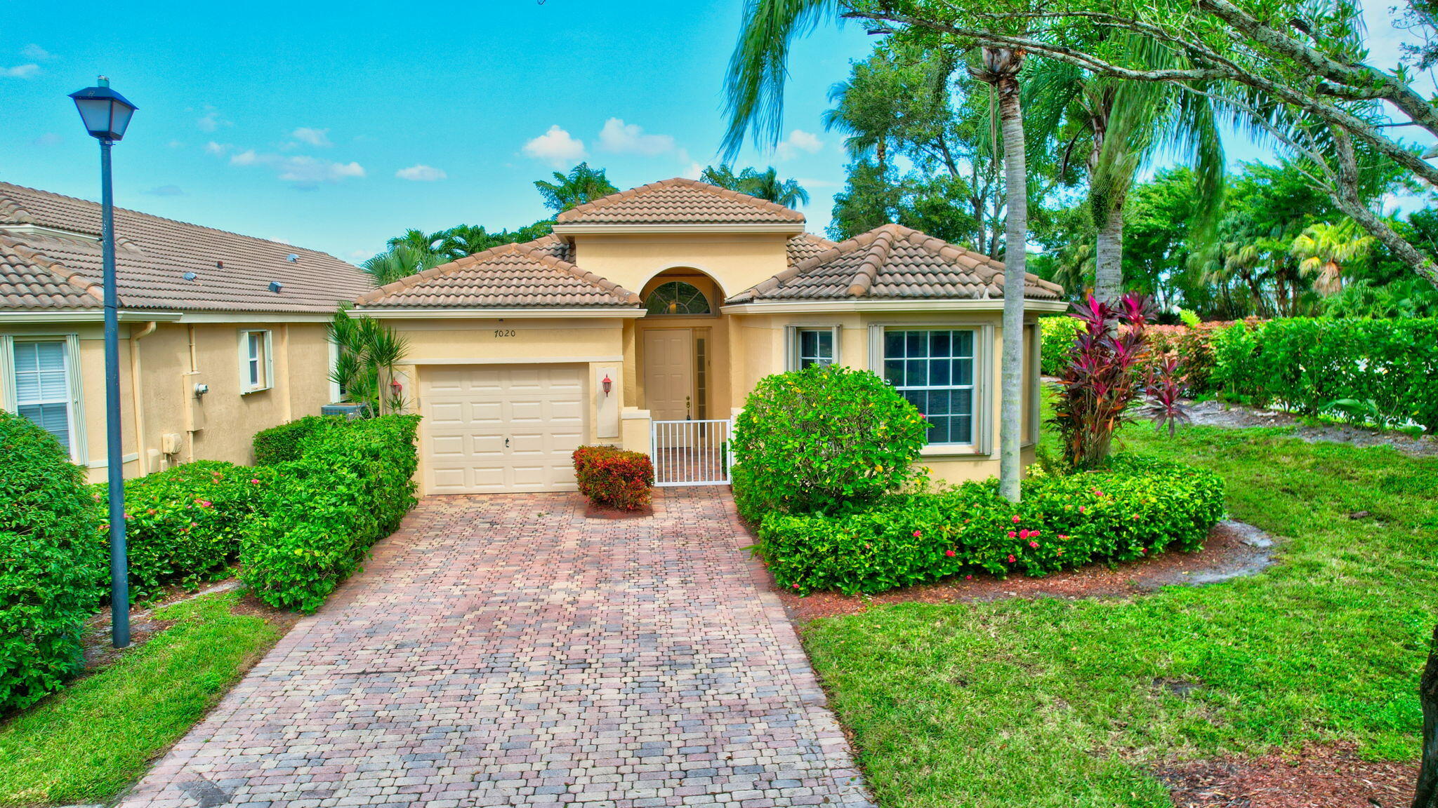 a front view of a house with garden