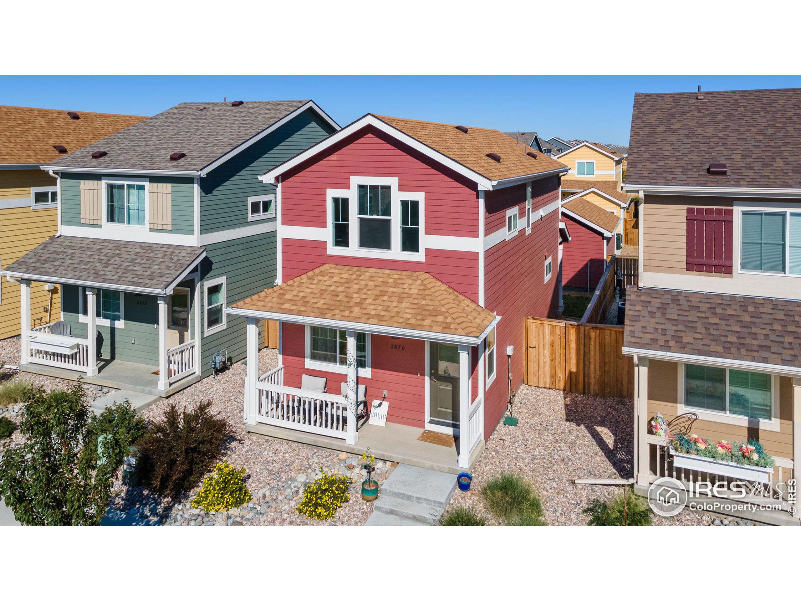 a aerial view of a house with a yard