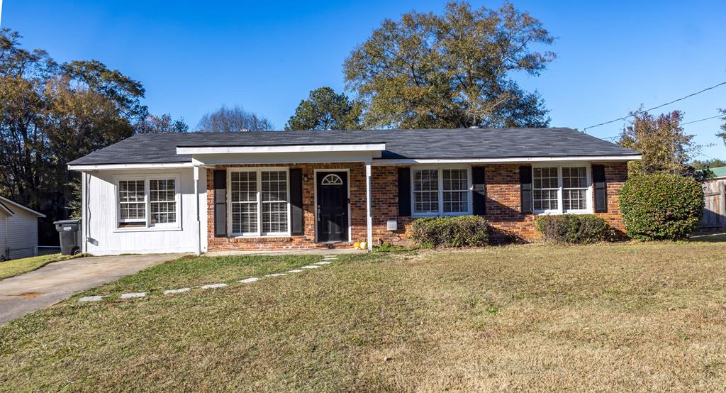 front view of a house with a yard