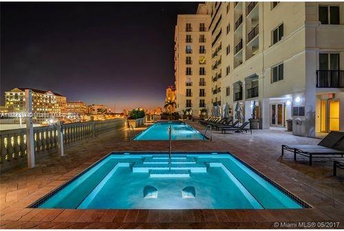 a view of swimming pool from a balcony