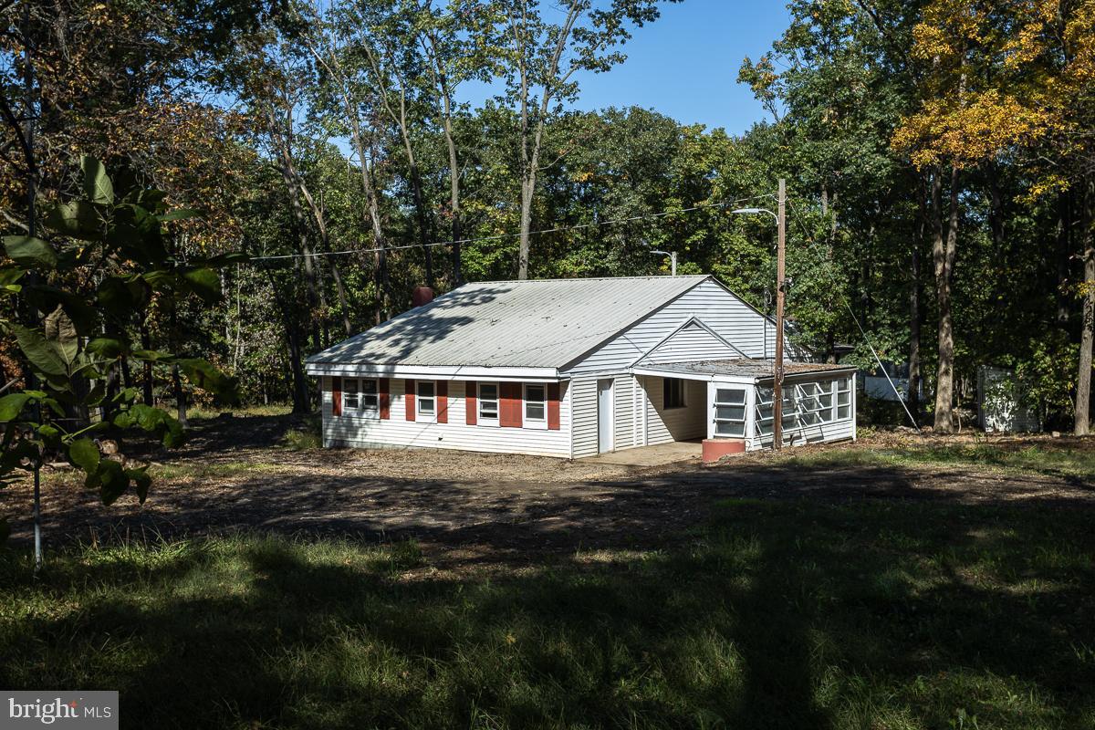 front view of a house with a garden