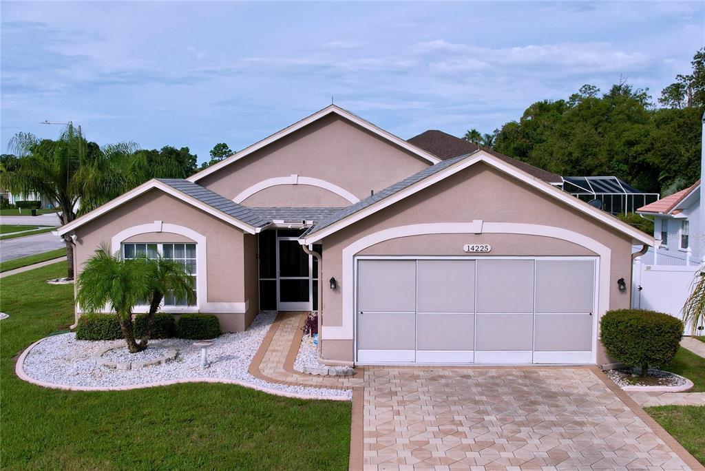 a front view of a house with garden