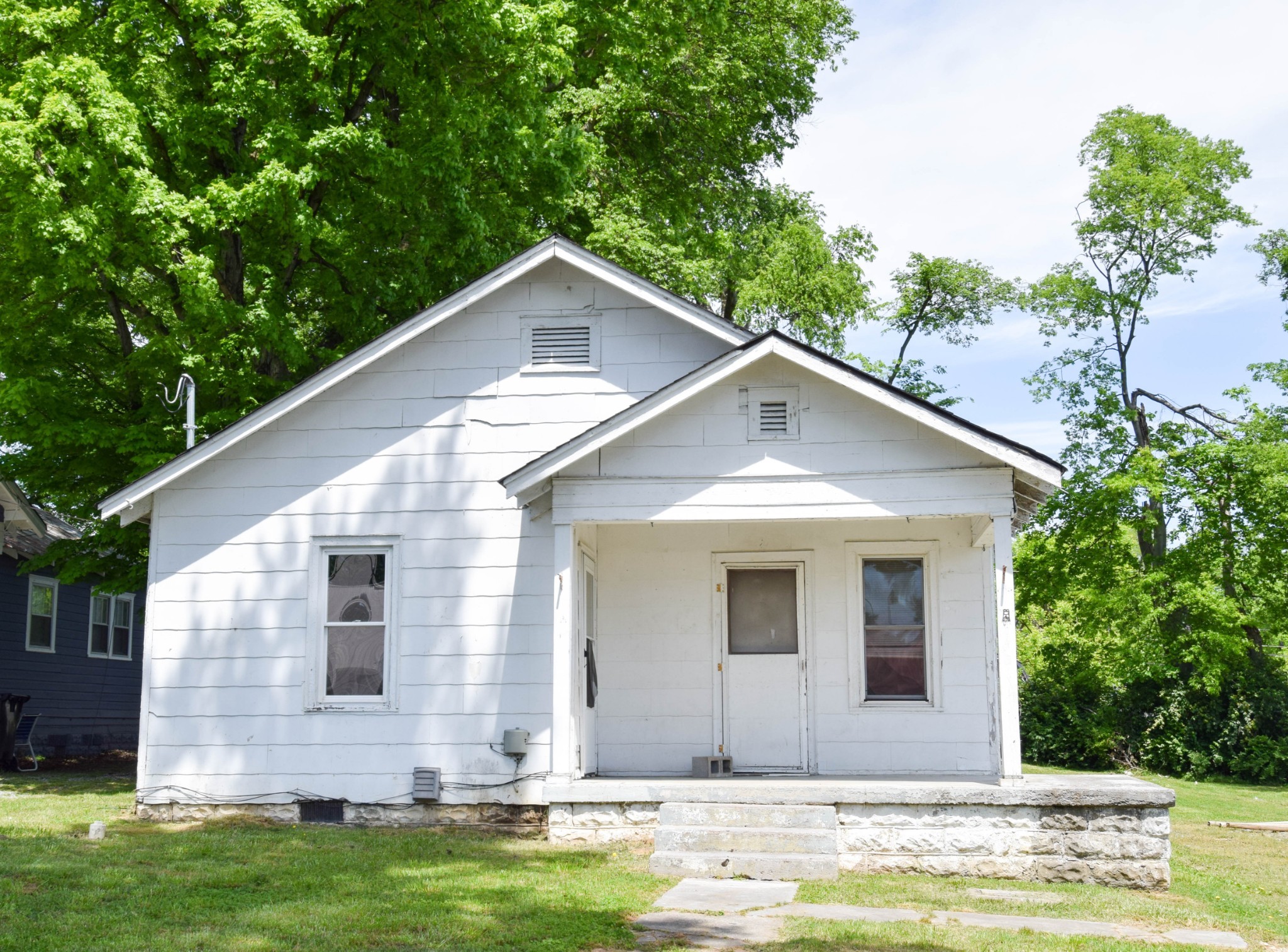 a view of a house with pool and yard