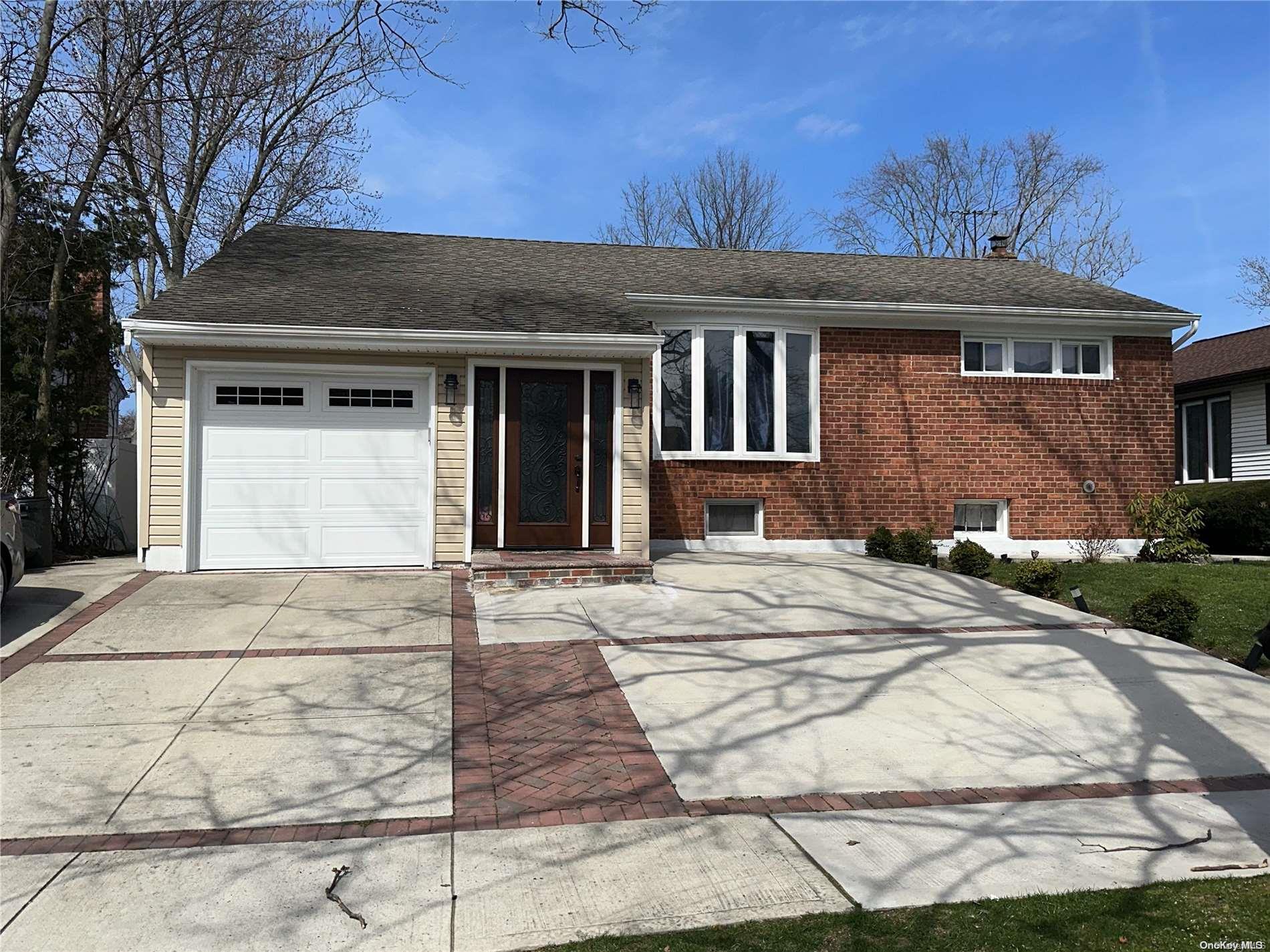 a front view of a house with yard