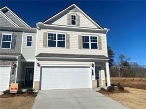 a front view of a house with a garage