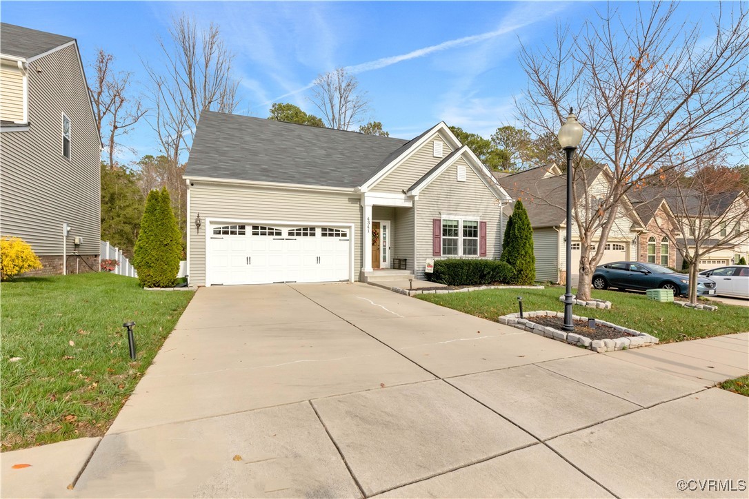 View of front of property featuring a garage and a