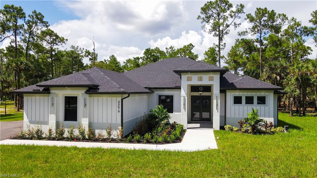 Prairie-style house with a front lawn