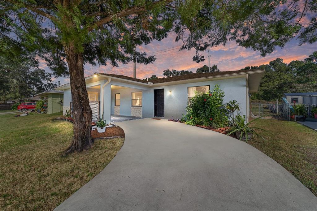 front view of a house with a yard