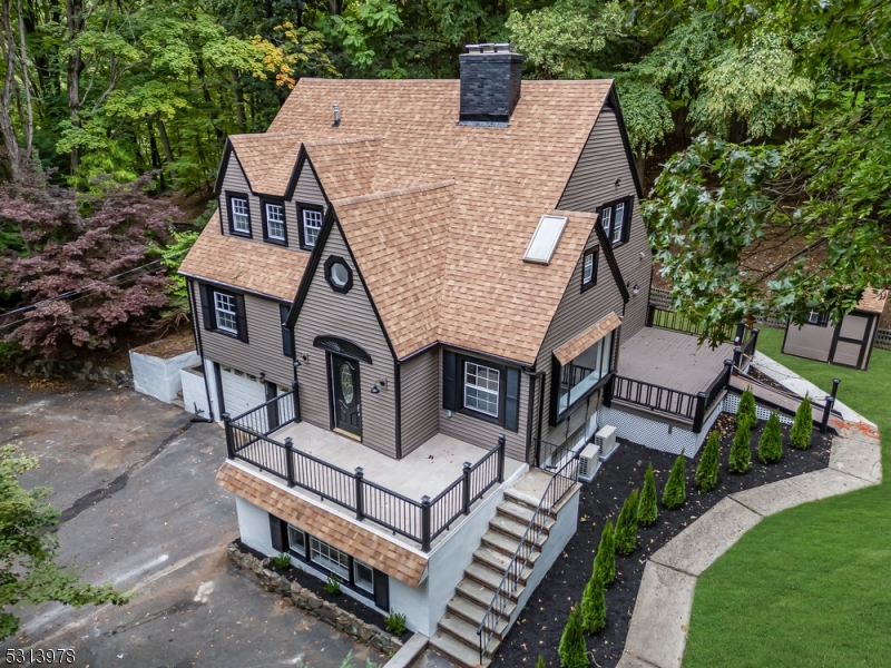 a roof view with sitting space and garden