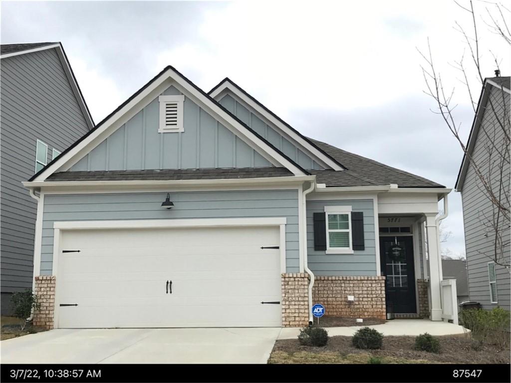 a front view of a house with garage