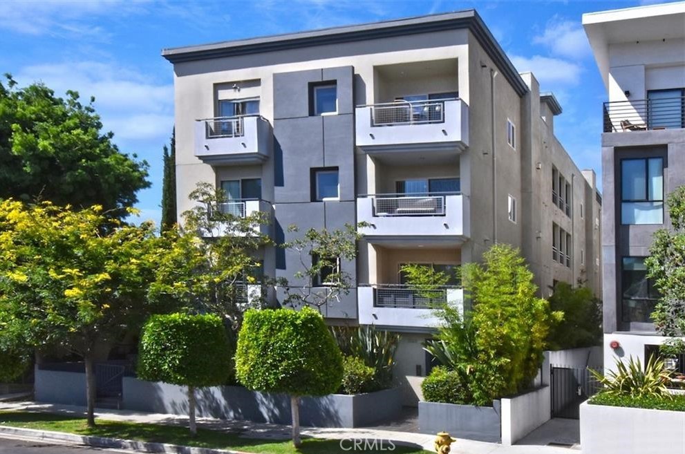 a front view of a multi story residential apartment buildings