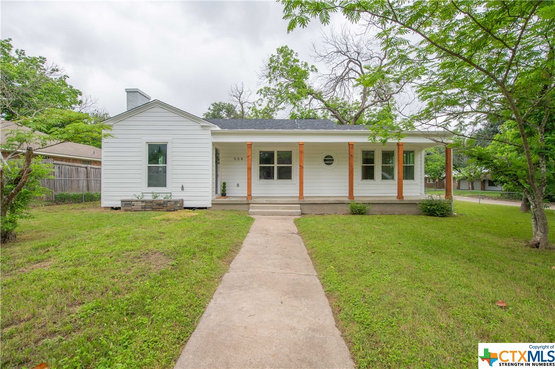 front view of a house with a yard