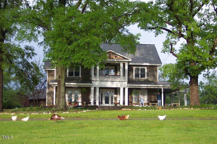 a front view of a residential apartment building with a yard