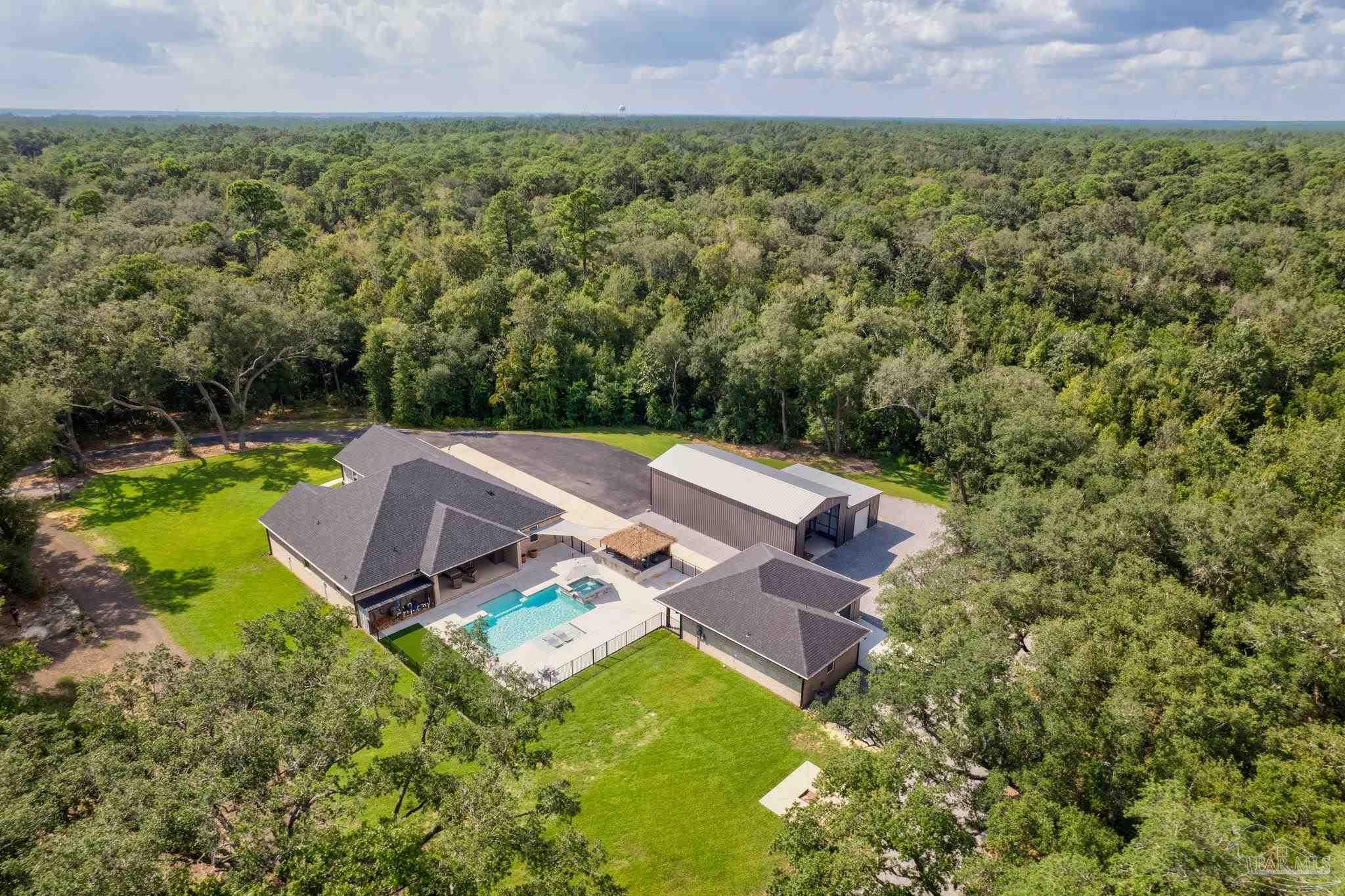 an aerial view of a house with a garden