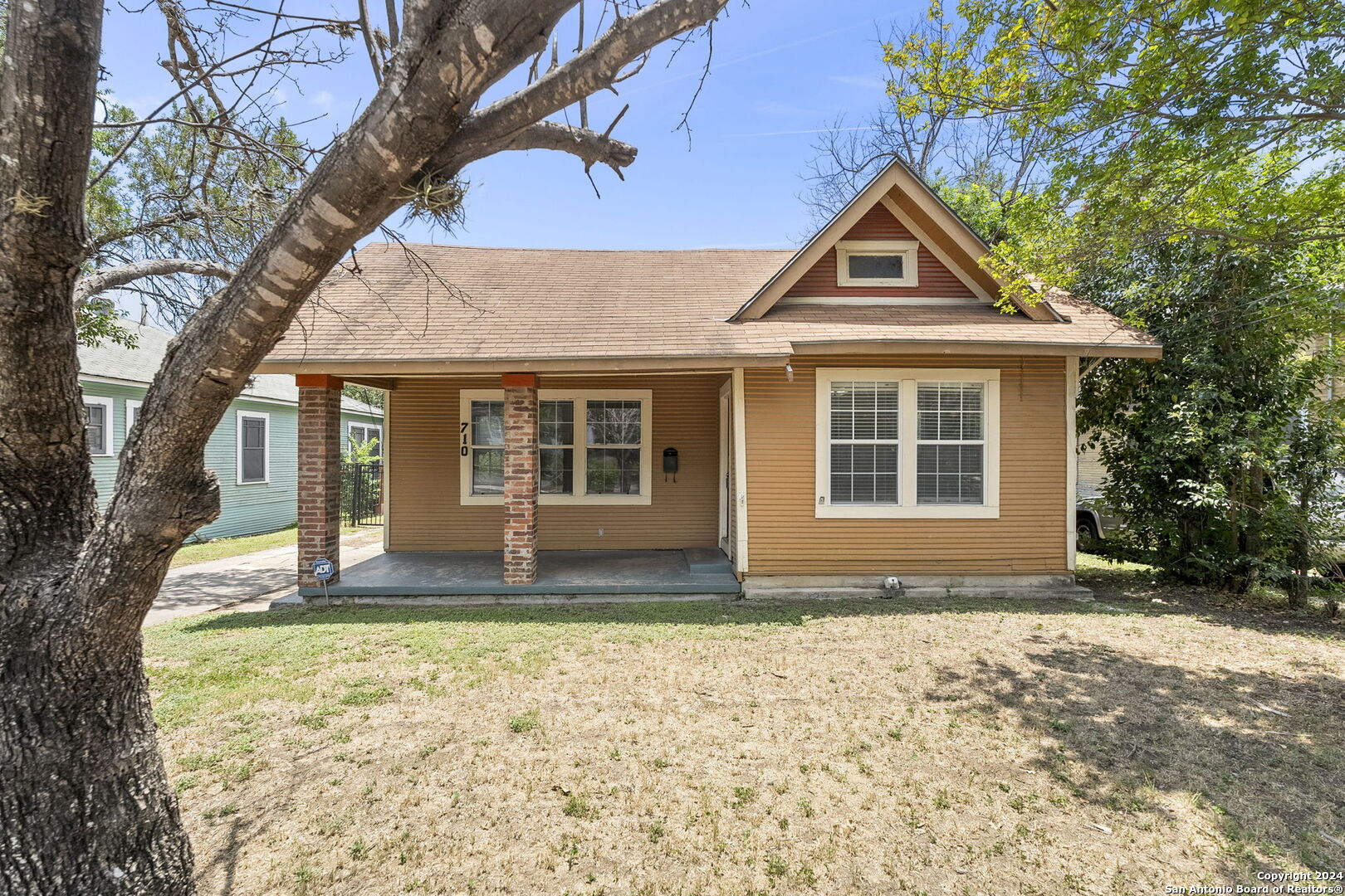 a house with trees in the background