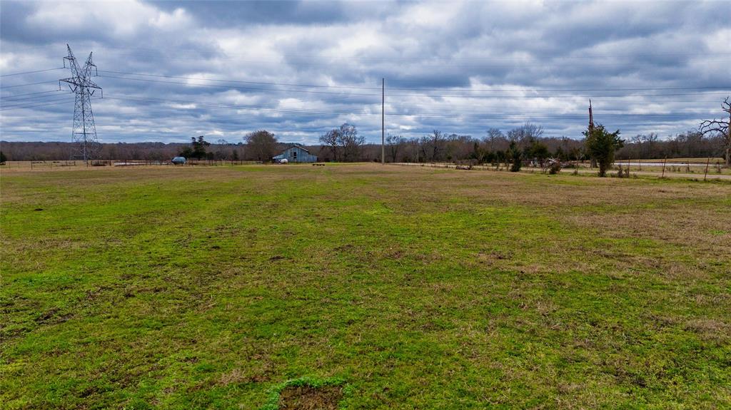 a view of a field with an ocean