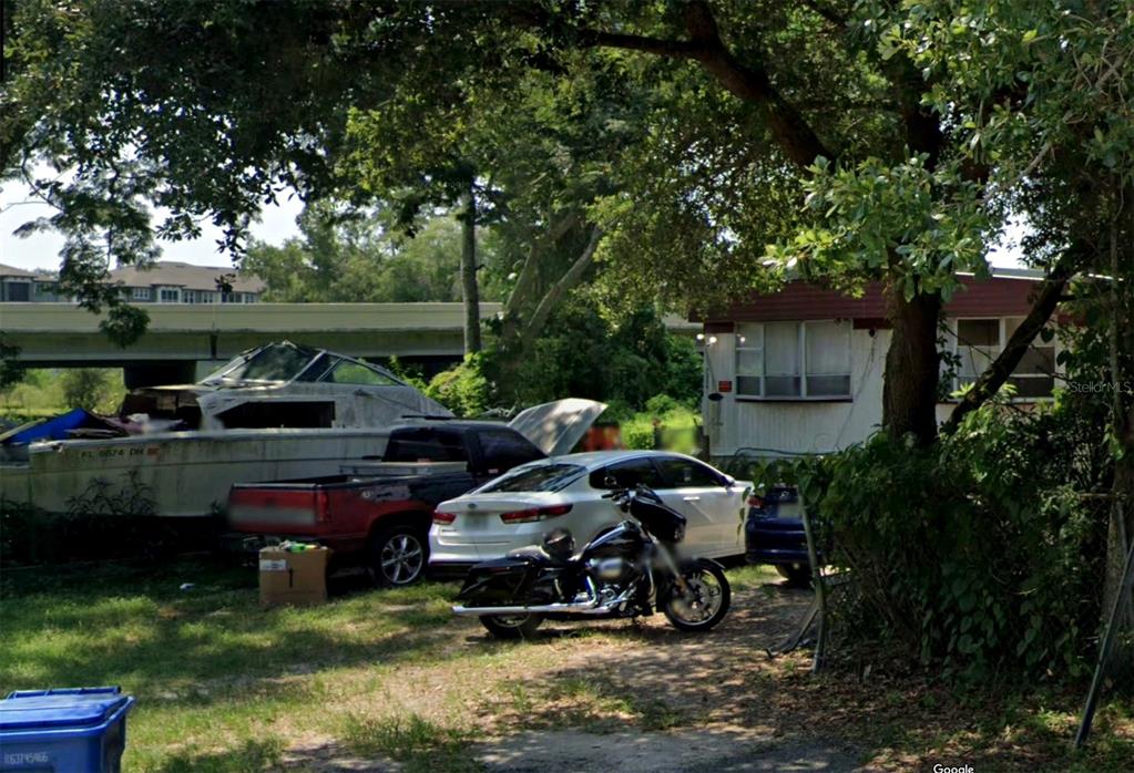 a table and chairs in front of a house