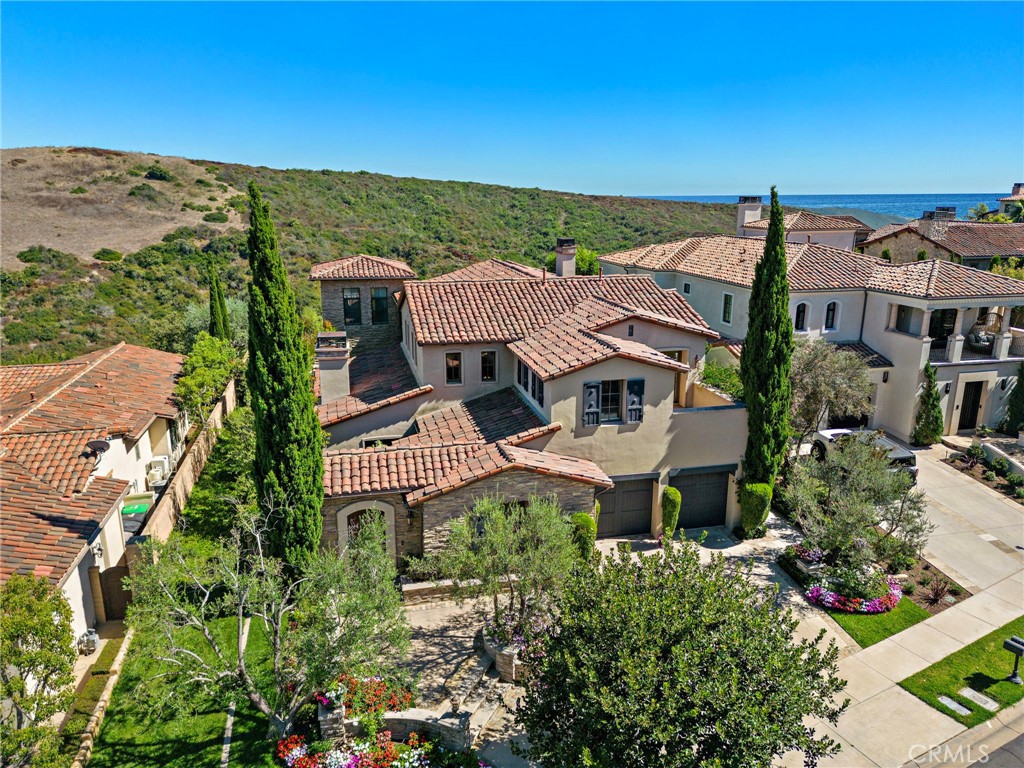 an aerial view of multiple houses with a yard