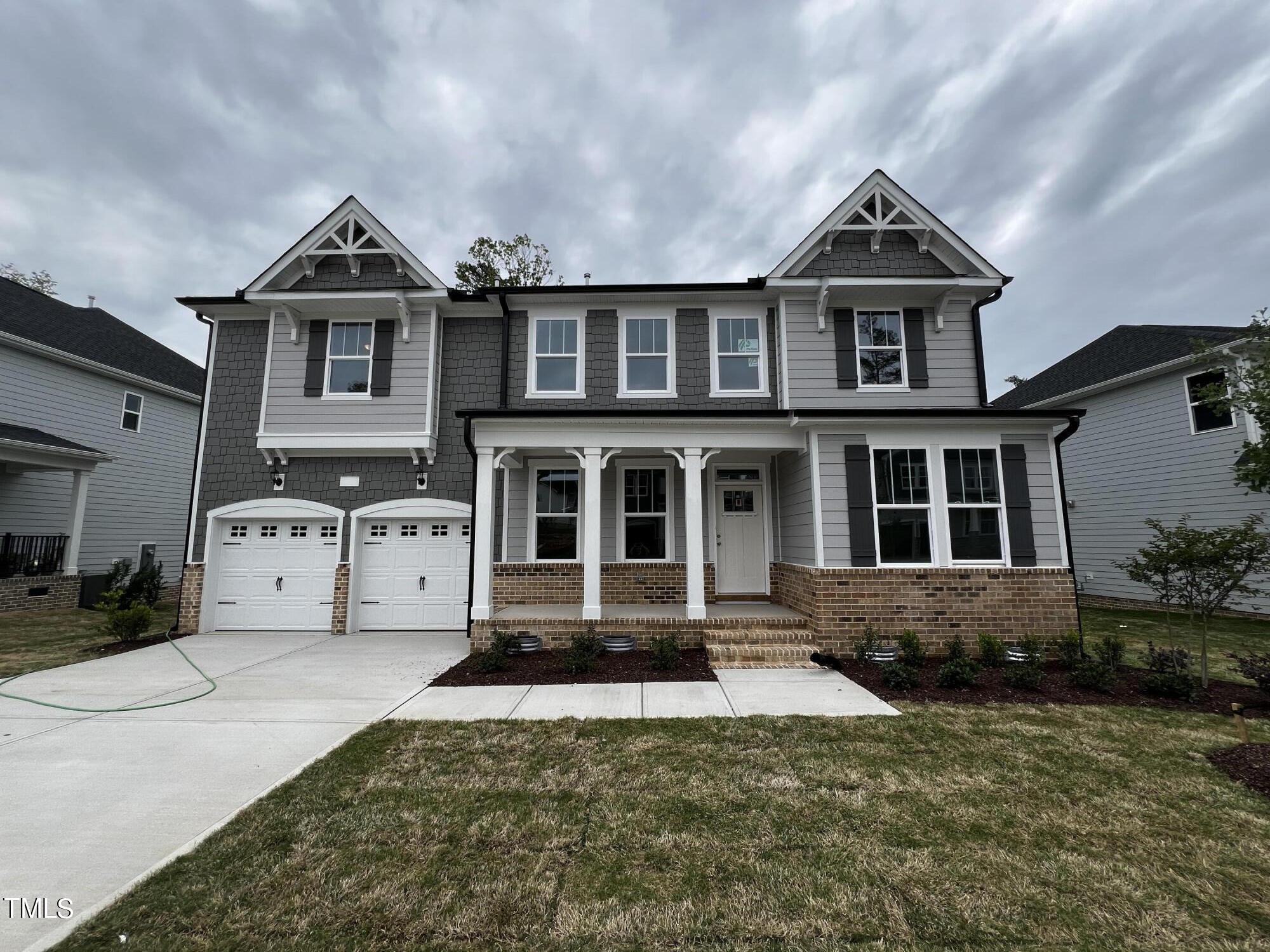 a front view of a house with yard