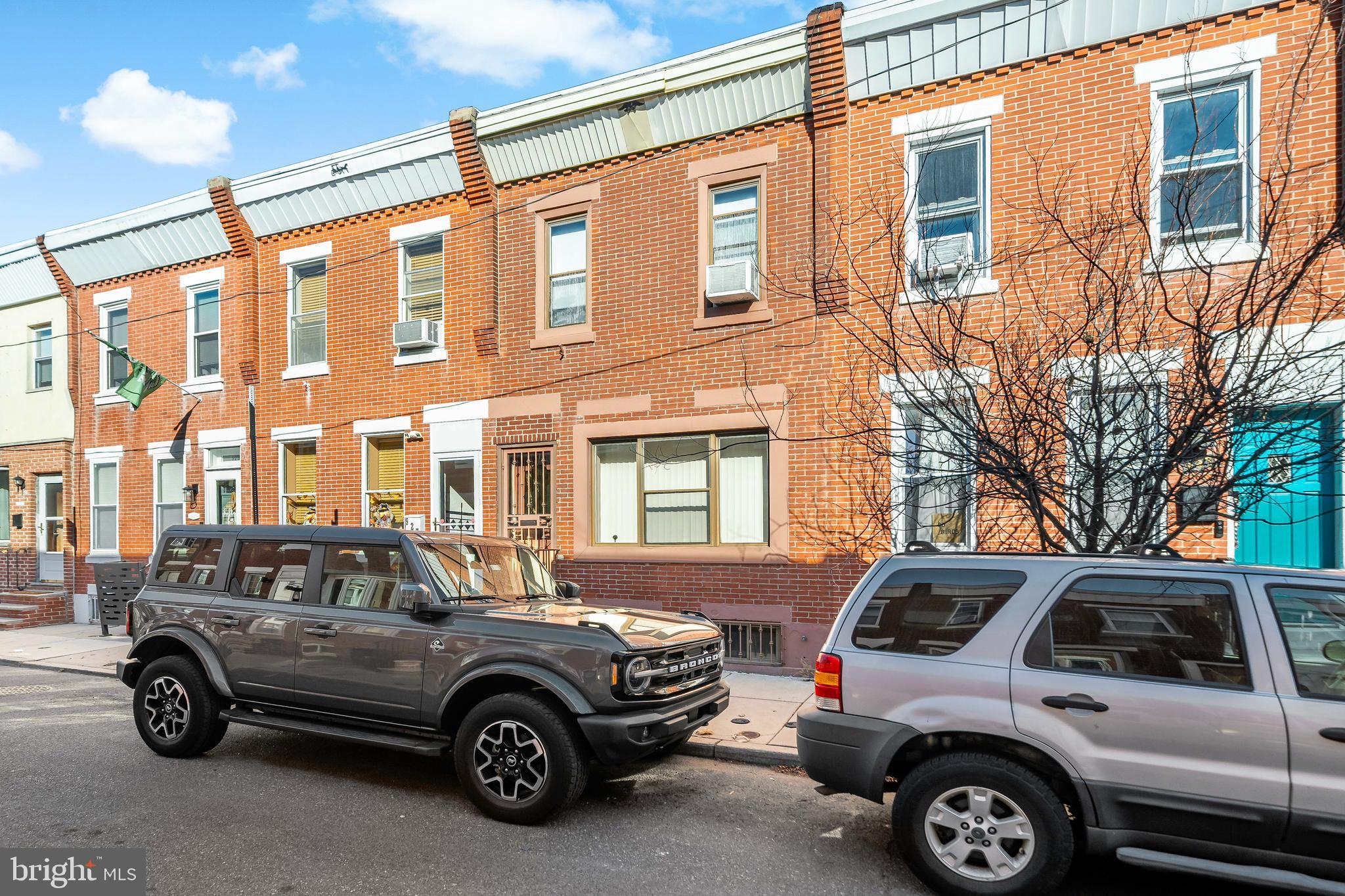 a view of a car parked in front of a house