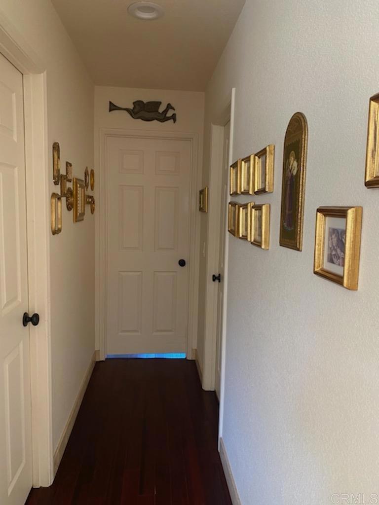 a view of a hallway with front door