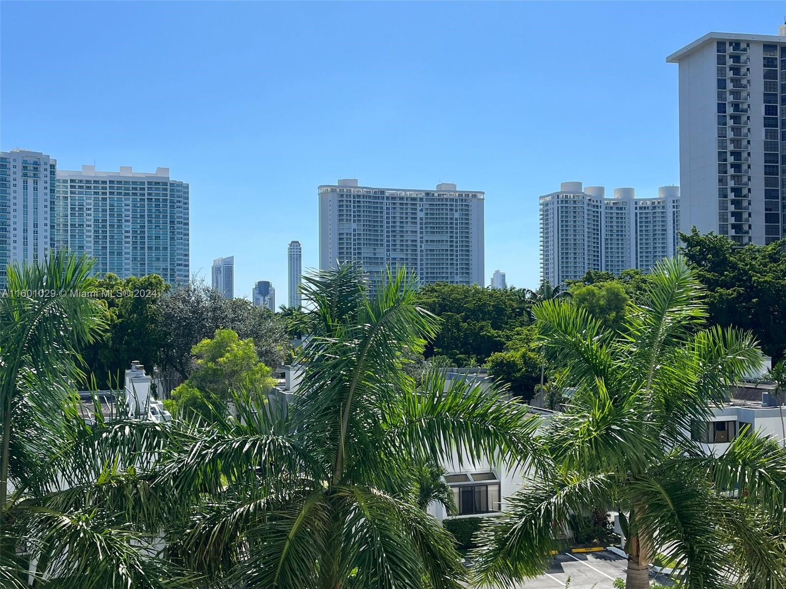 a view of a city with tall buildings