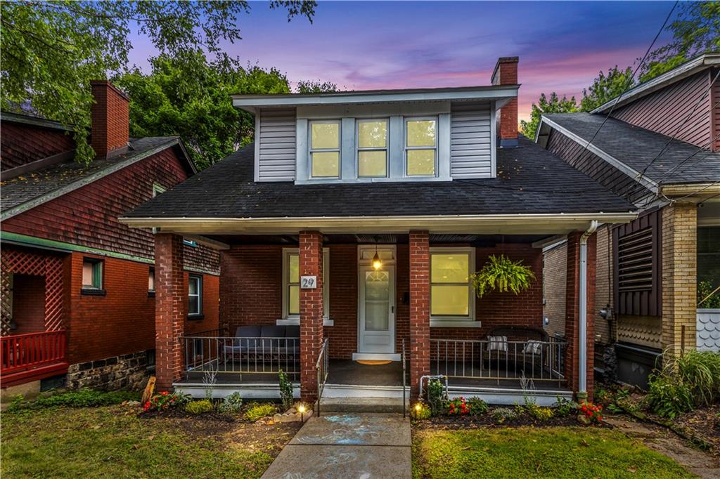 a front view of a house with a porch