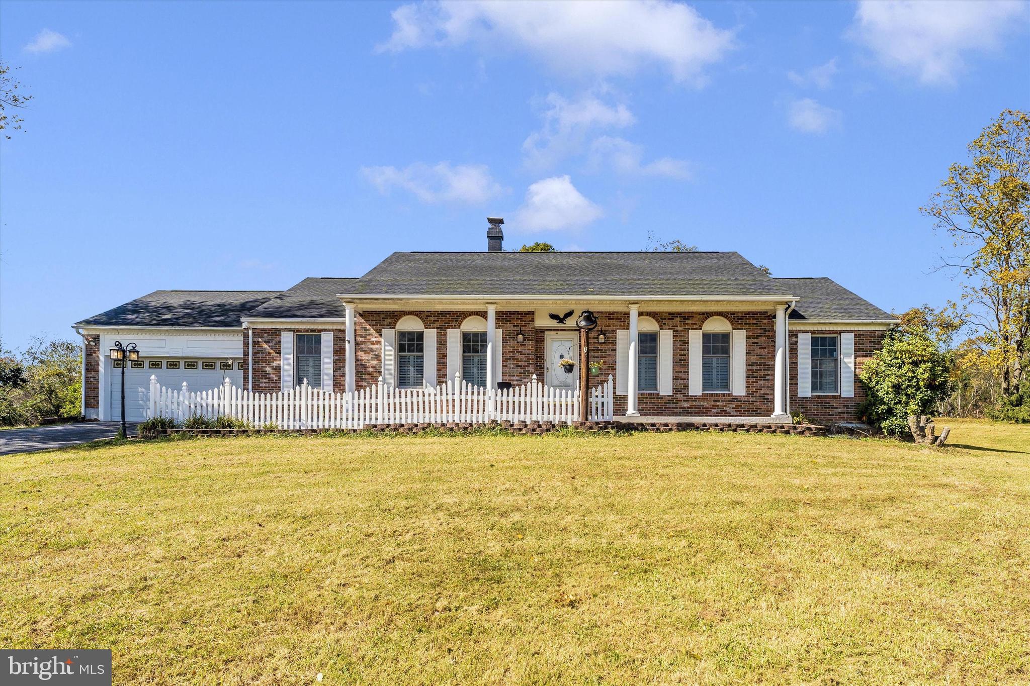 a front view of a house with swimming pool